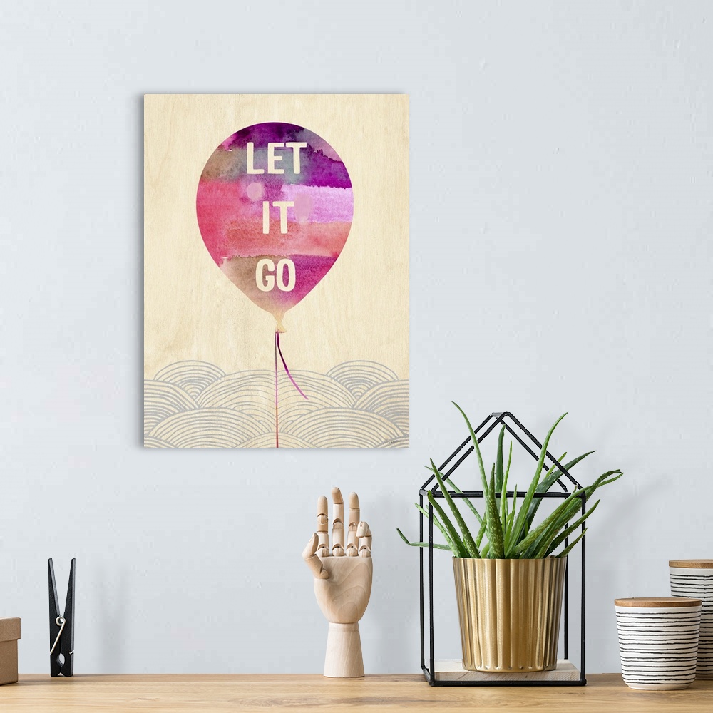 A bohemian room featuring Contemporary watercolor painting of a pink balloon with text in it.