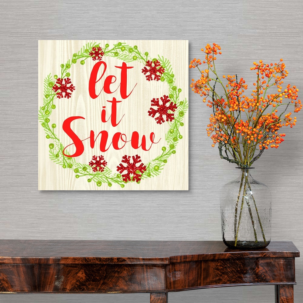 A traditional room featuring "Let It Snow" written in red inside of a Christmas wreath on a faux wood background.