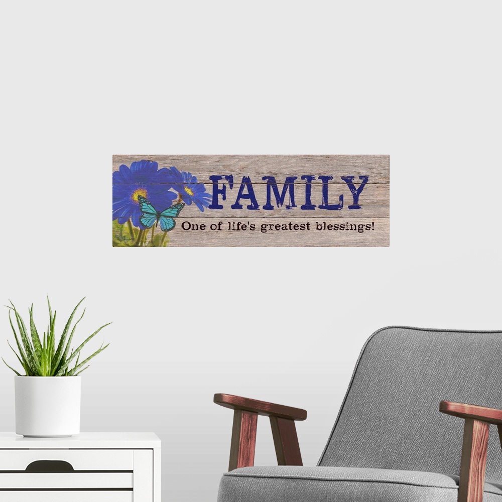 A modern room featuring Contemporary family art using flowers and typography on a rustic looking wooden surface.