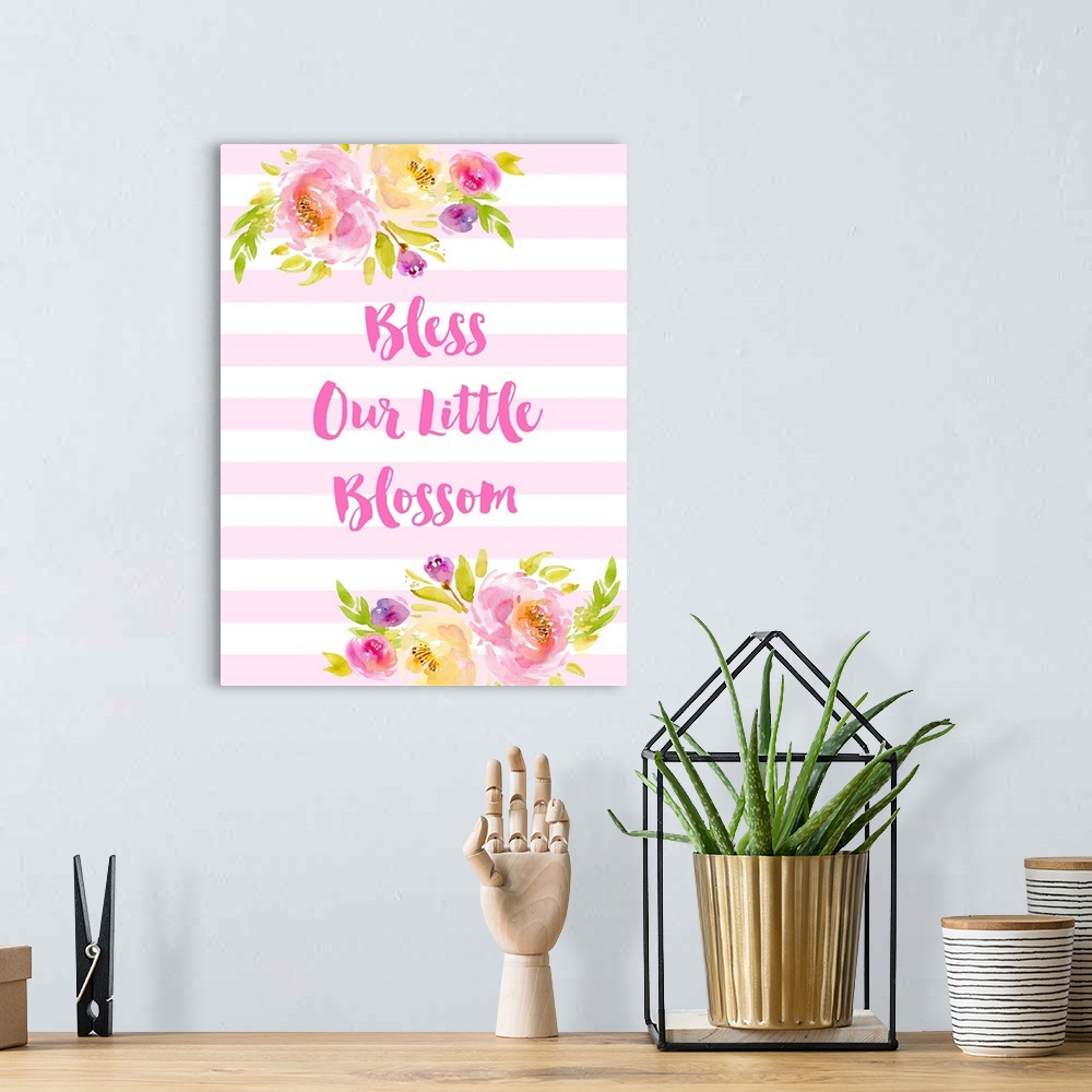 A bohemian room featuring "God Bless Our Little Blossom" in pink and white with illustrated flowers.