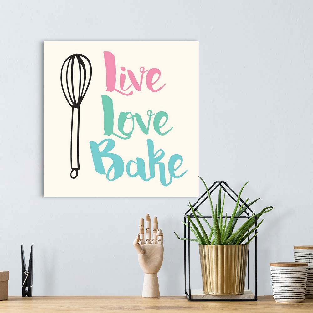 A bohemian room featuring Kitchen art with handlettered text and a whisk illustration.
