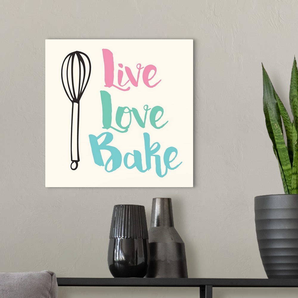 A modern room featuring Kitchen art with handlettered text and a whisk illustration.