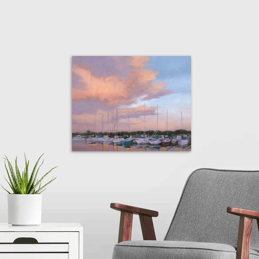 A modern room featuring Contemporary painting of boats in a harbor in low light at sunset.