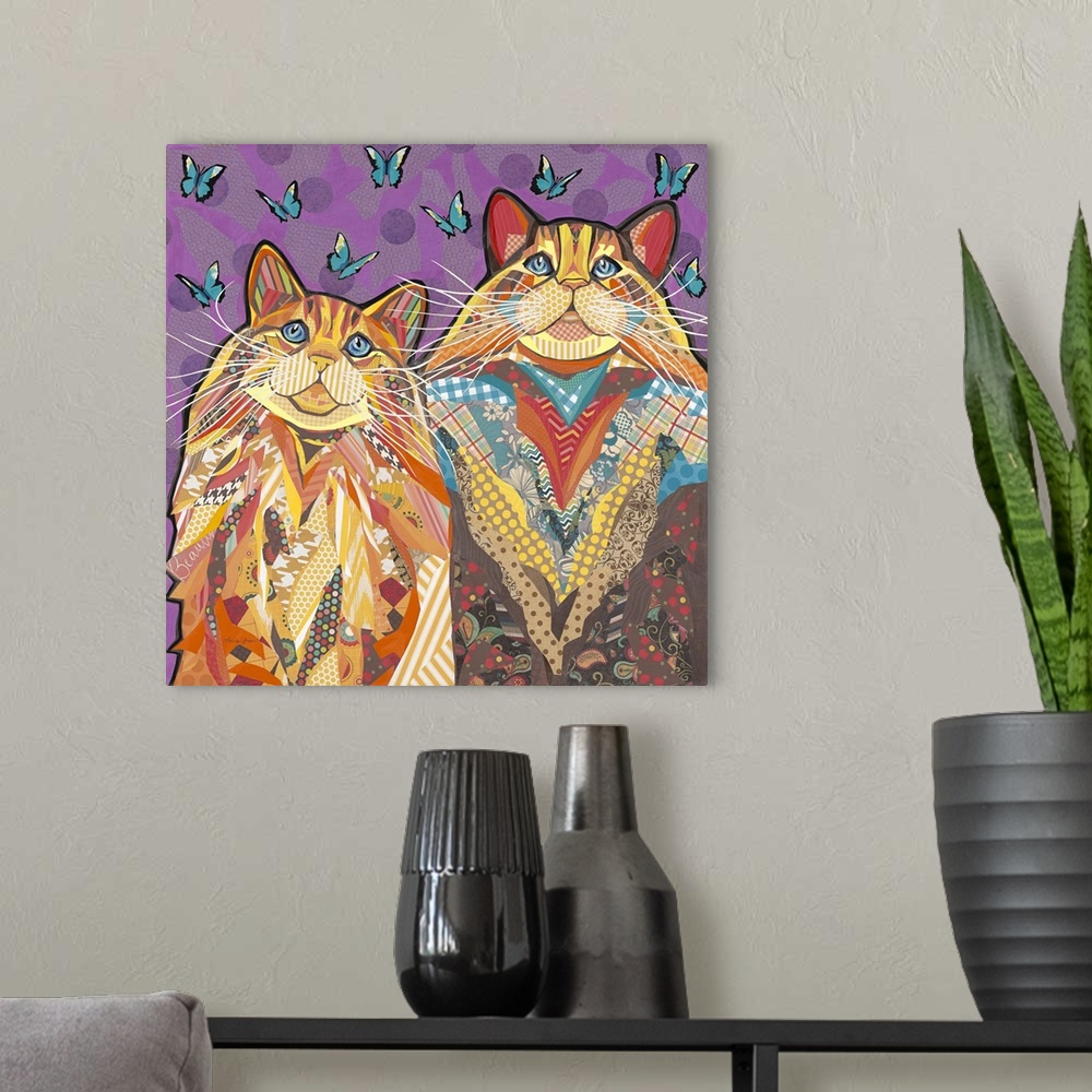 A modern room featuring Colorful collage artwork of two cats with long whiskers.
