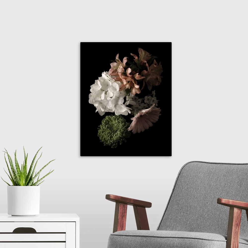 A modern room featuring Moody photograph of a bouquet of pastel flowers on black in low light.
