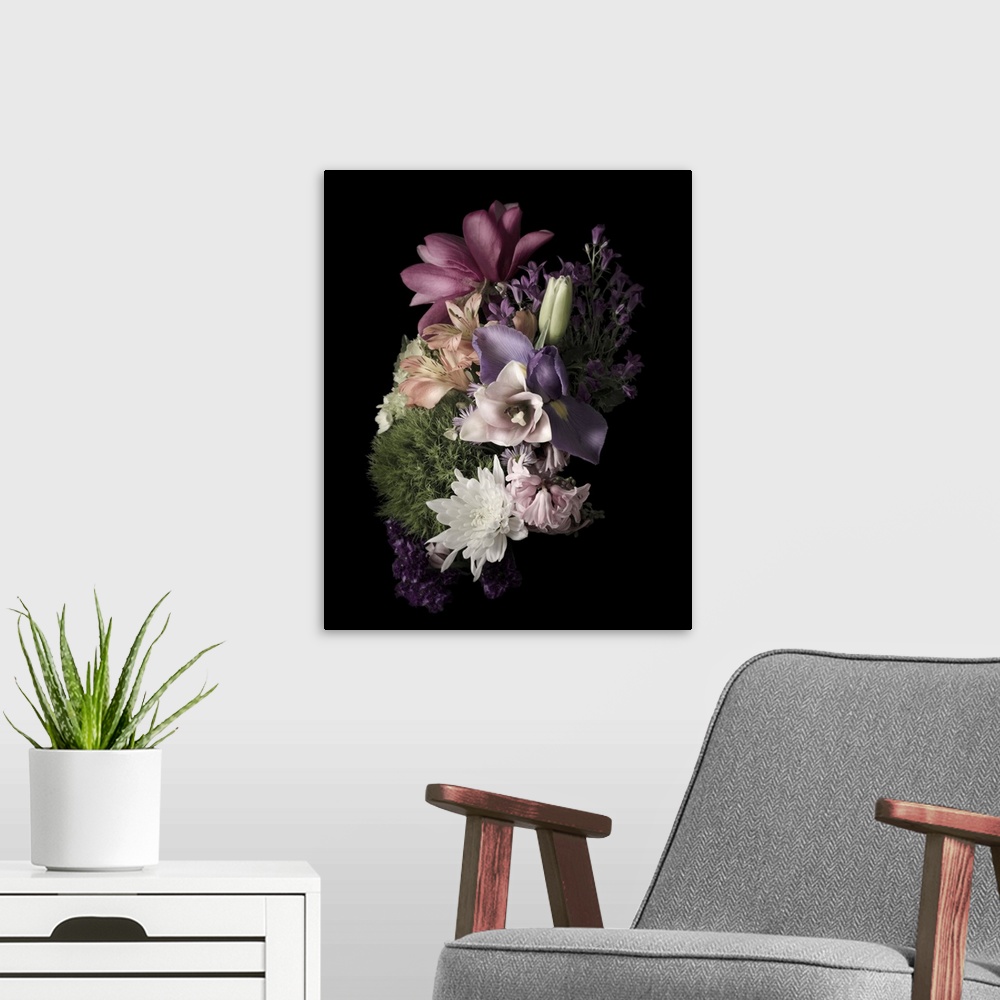 A modern room featuring Moody photograph of a bouquet of pastel flowers on black in low light.