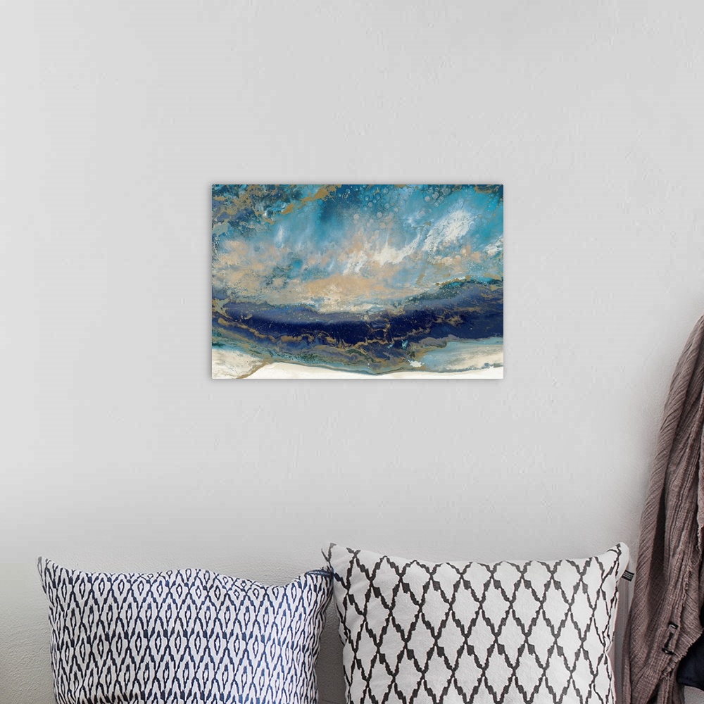 A bohemian room featuring Contemporary abstract artwork in blue and gold, resembling a seascape.