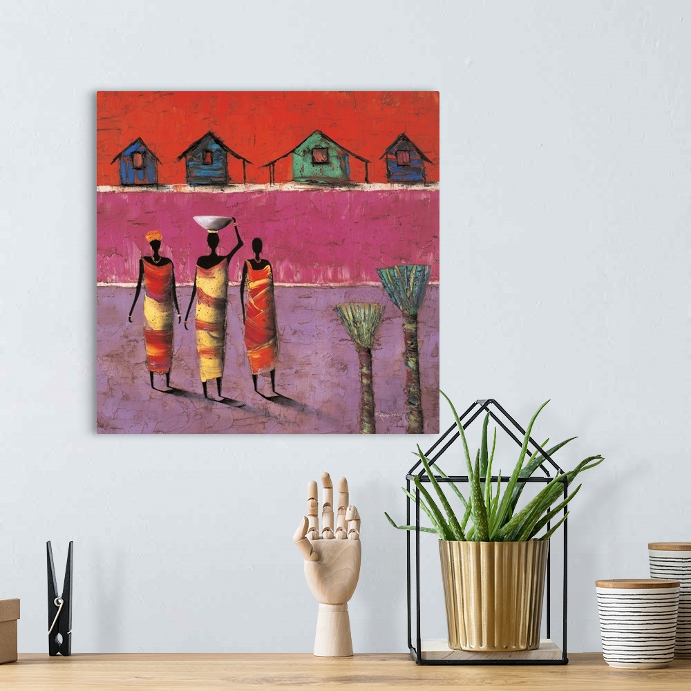 A bohemian room featuring Contemporary painting of three figures standing in front of colorful houses in the background.