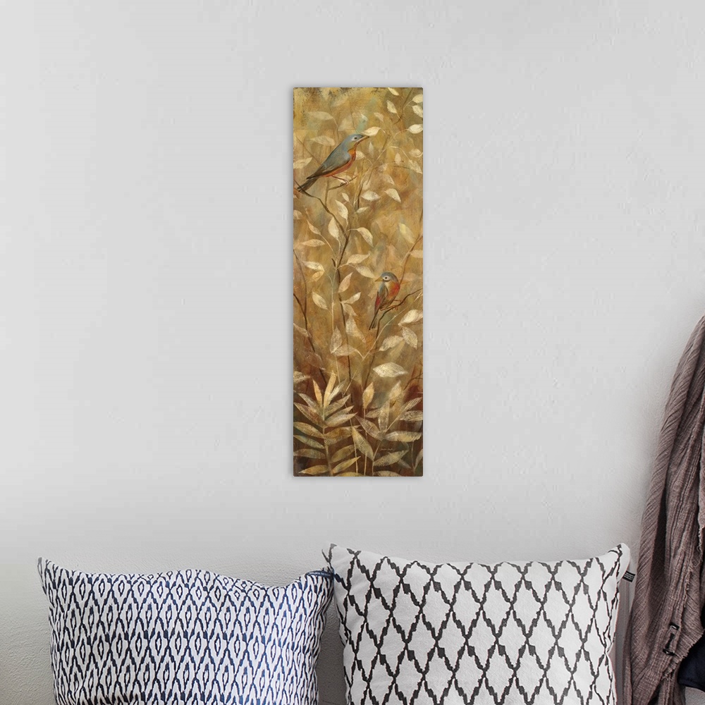 A bohemian room featuring Vertical painting of two garden birds on golden branches.
