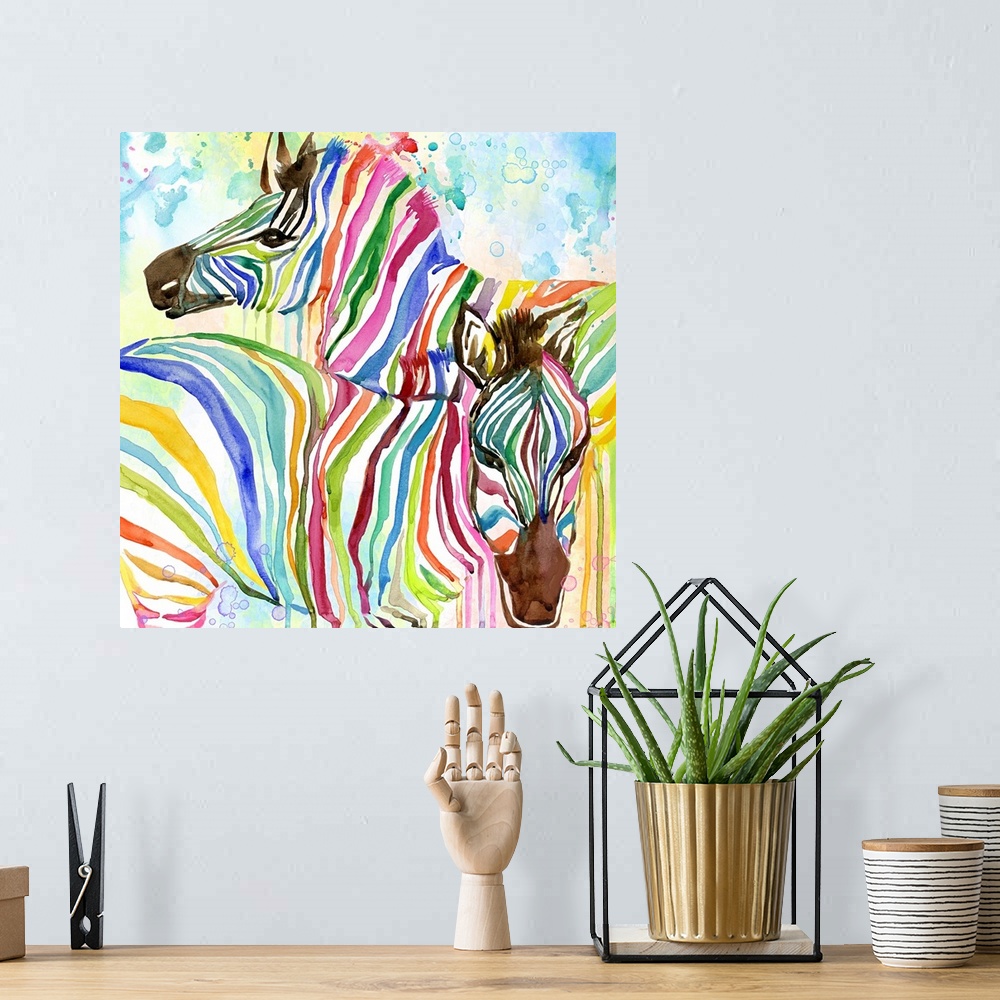 A bohemian room featuring Two zebras with rainbow stripes.