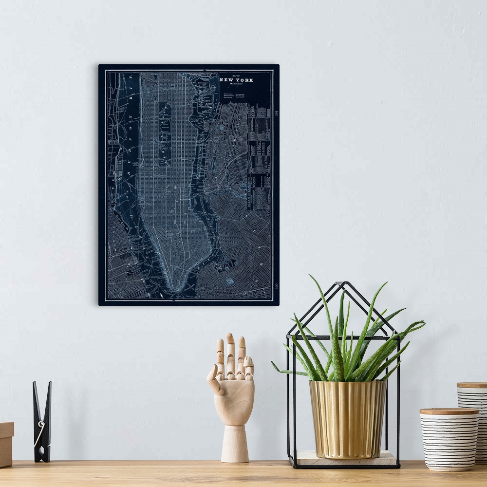 A bohemian room featuring Map of New York City in dark blue and white.