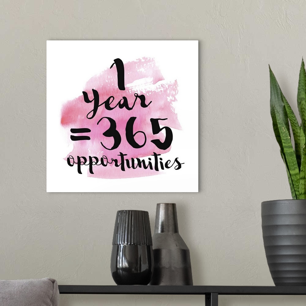 A modern room featuring Handlettered black text reading "1 Year = 365 Opportunities" over a pink watercolor wash.