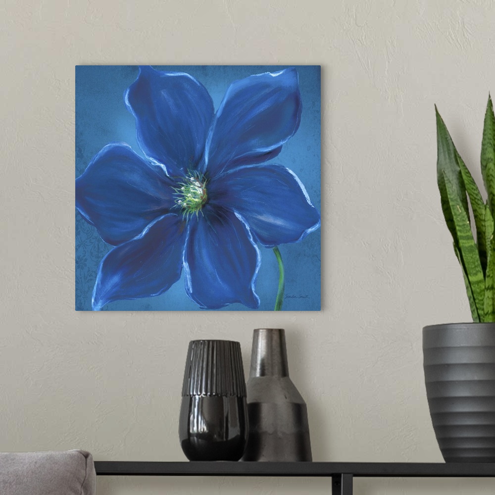 A modern room featuring Close up painting of a deep blue flower with wide petals.