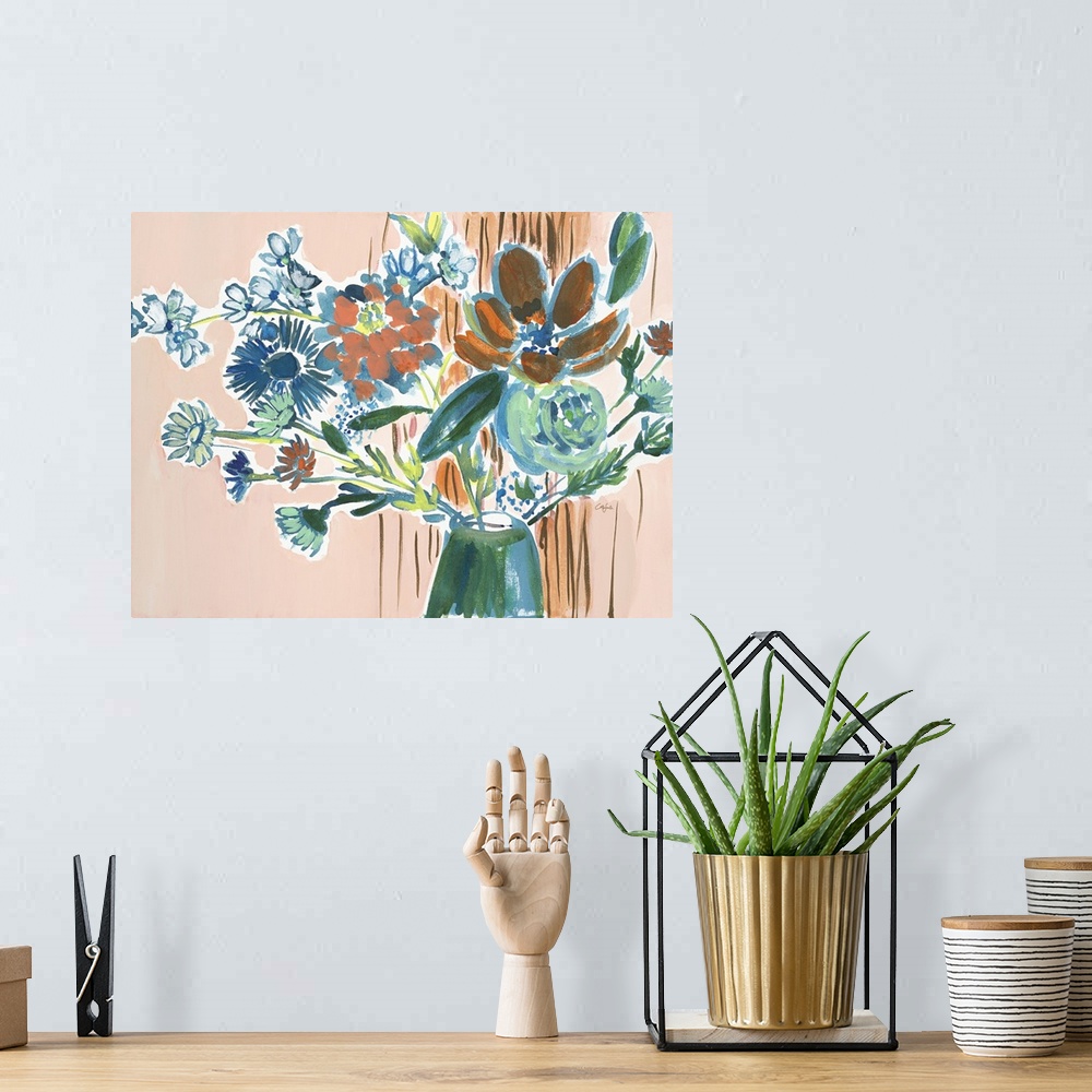 A bohemian room featuring Watercolor painting of a bouquet of orange, green, and blue flowers on tan.