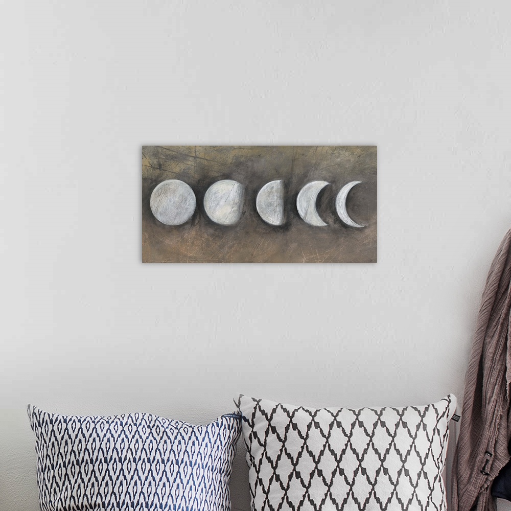 A bohemian room featuring Contemporary artwork of the moon in five phases.