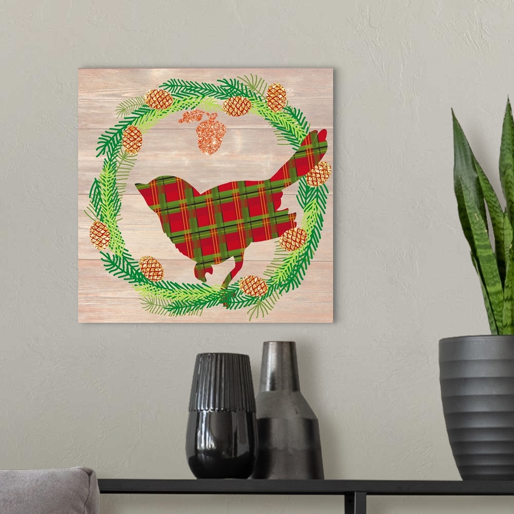 A modern room featuring Plaid silhouette of a cardinal inside of a Winter wreath in blue, green, and gold hues on a faux ...