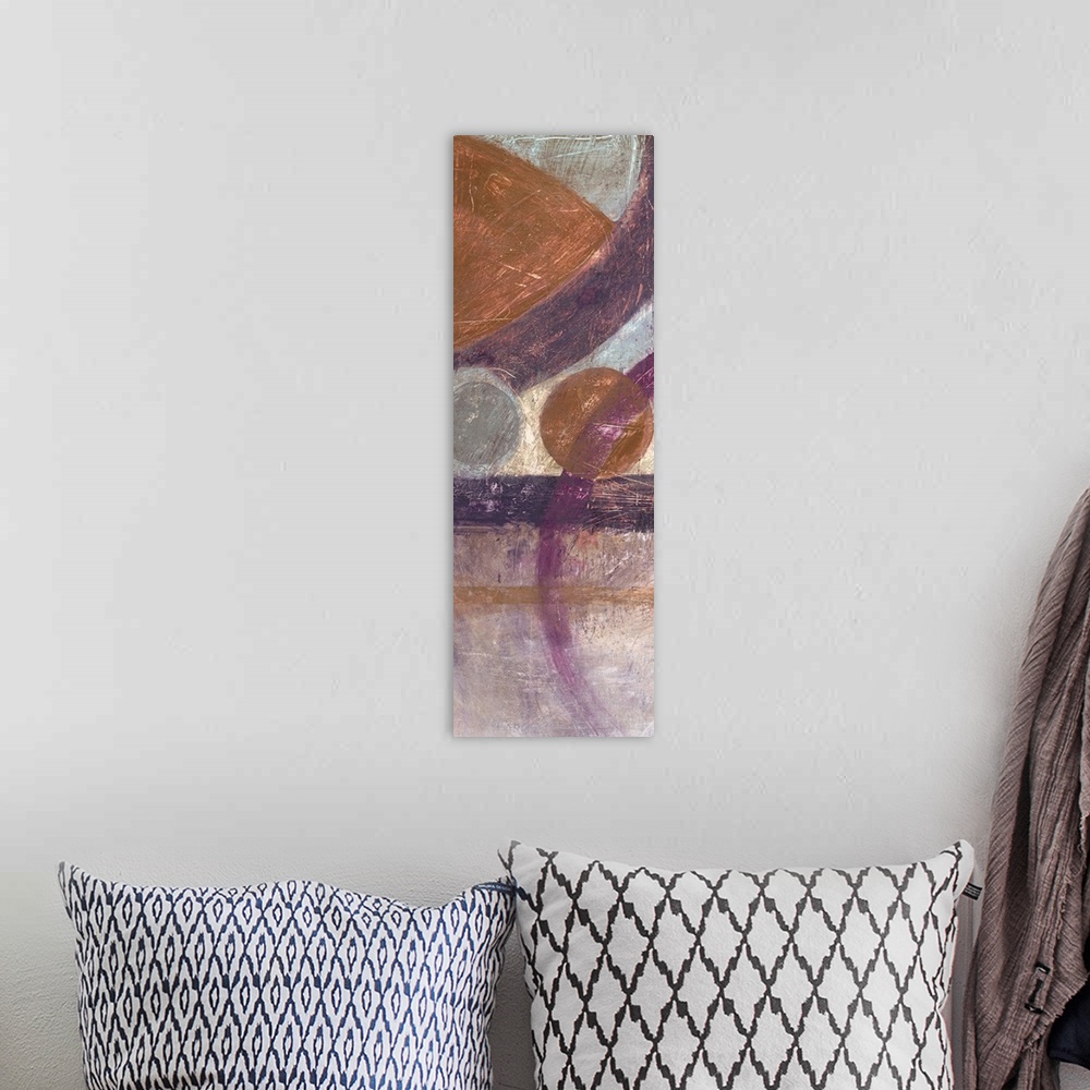 A bohemian room featuring Vertical abstract artwork with circular geometric shapes in browns and purples.