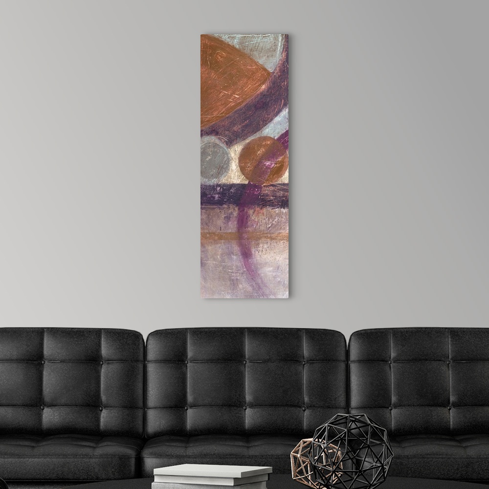 A modern room featuring Vertical abstract artwork with circular geometric shapes in browns and purples.