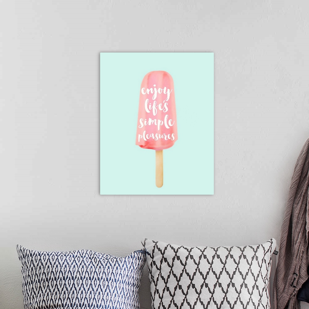 A bohemian room featuring "Enjoy Life's Simple Pleasures" written inside of a pink popsicle on a pale blue background.