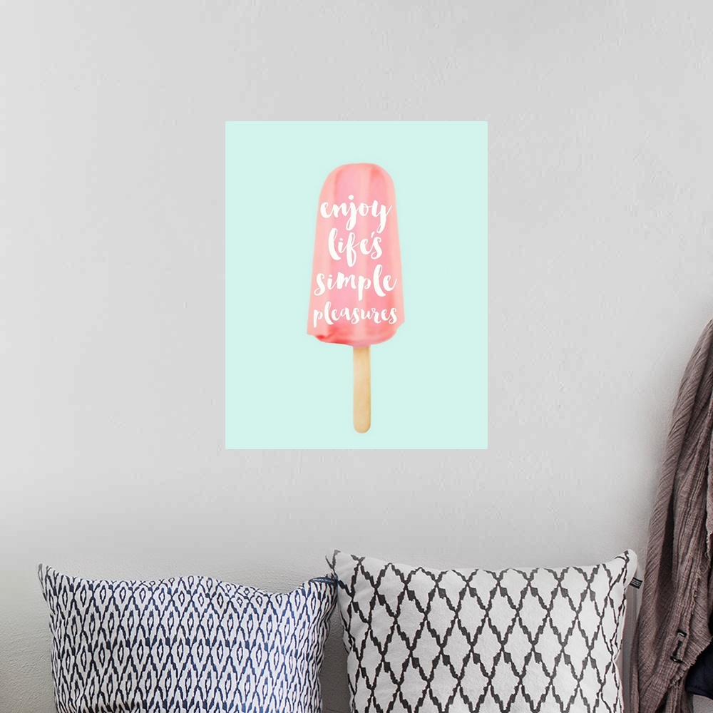 A bohemian room featuring "Enjoy Life's Simple Pleasures" written inside of a pink popsicle on a pale blue background.