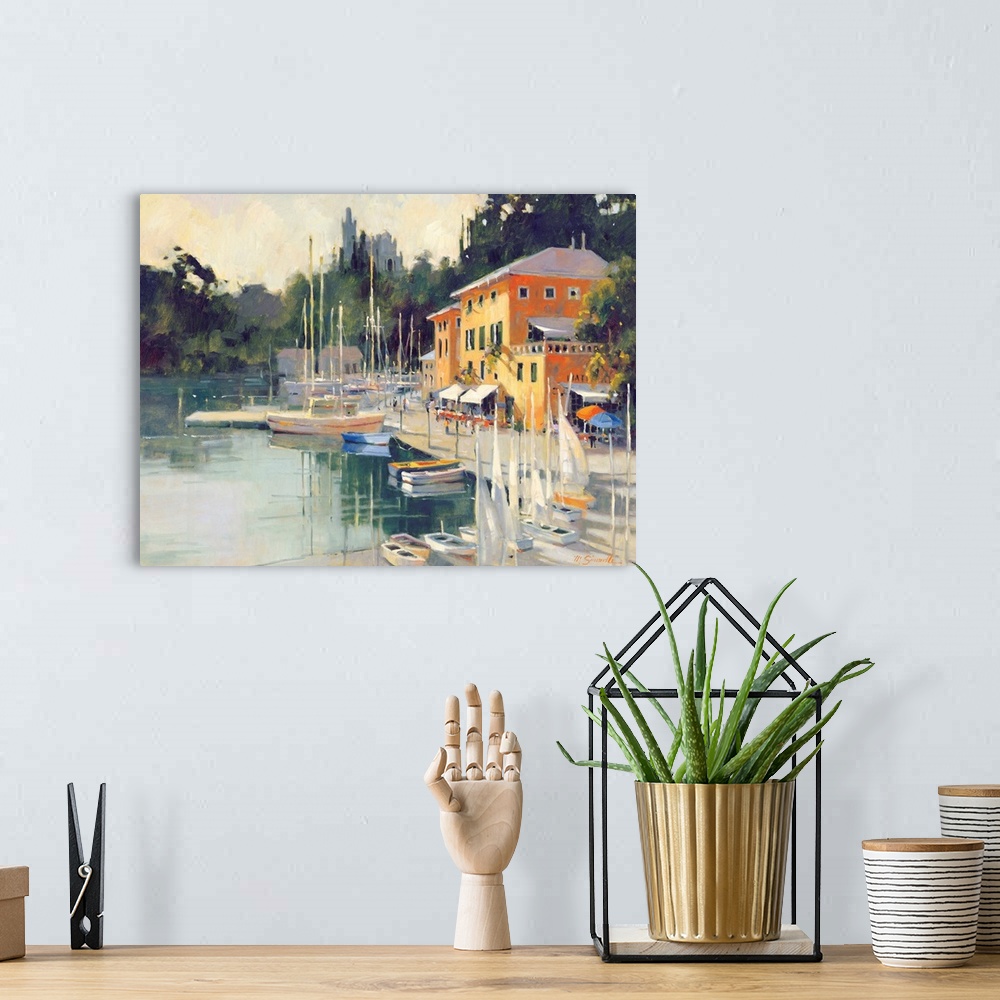 A bohemian room featuring Contemporary painting of a village harbor, with yellow buildings.
