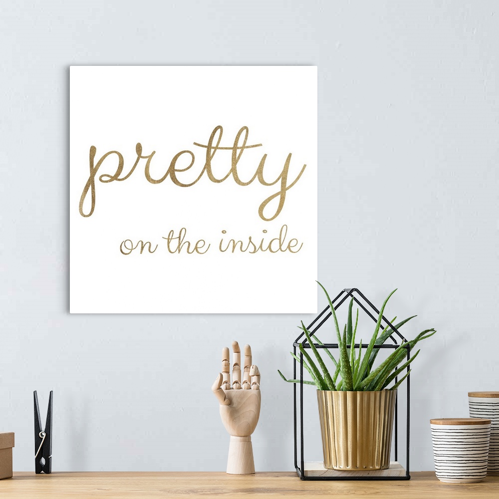 A bohemian room featuring Gold lettering against a white background.