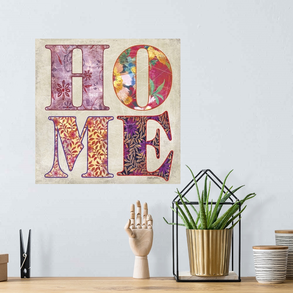 A bohemian room featuring The word "home" with brightly colored patterns in each letter.