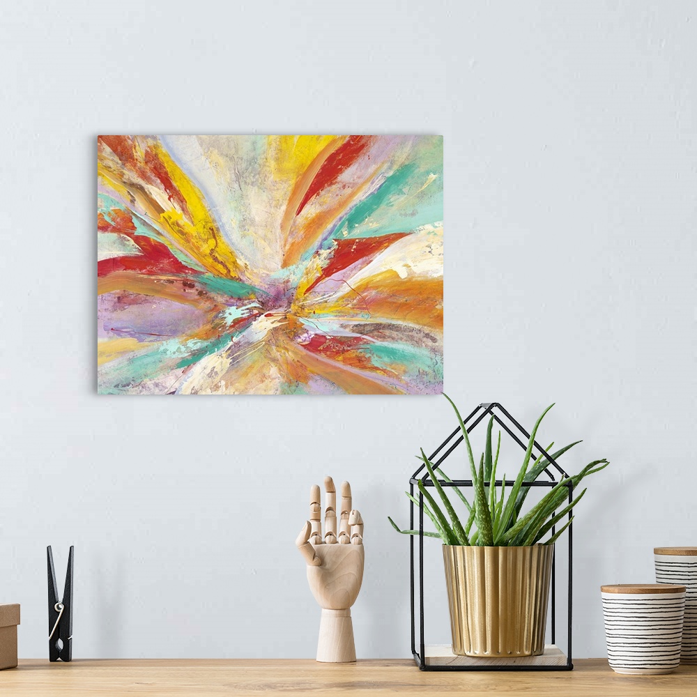 A bohemian room featuring Vibrantly colored contemporary abstract art with radiating red, teal, and orange colors.