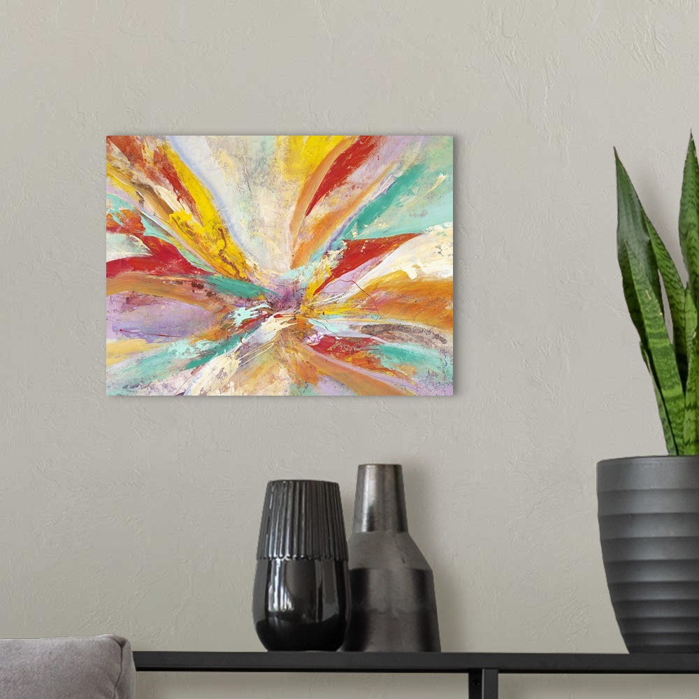 A modern room featuring Vibrantly colored contemporary abstract art with radiating red, teal, and orange colors.
