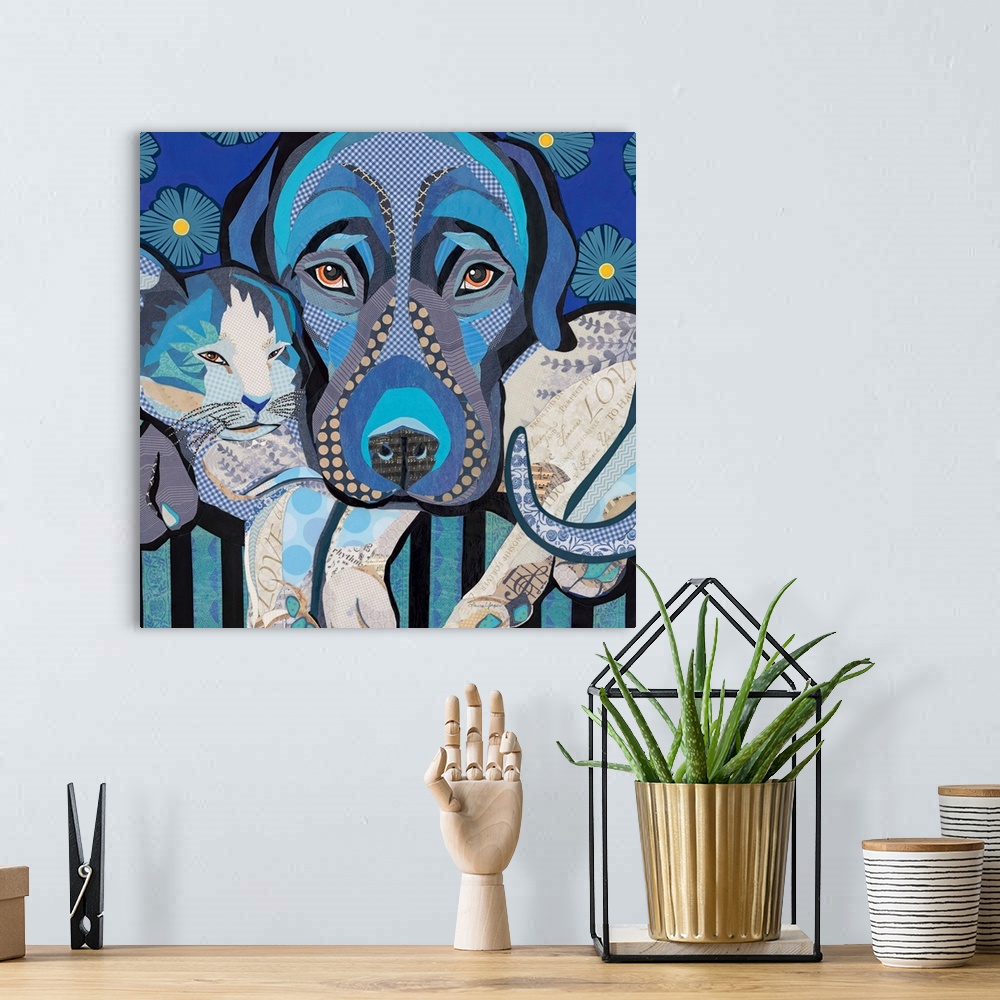 A bohemian room featuring Mixed media art of a dog and cat snuggling in cool blue tones.