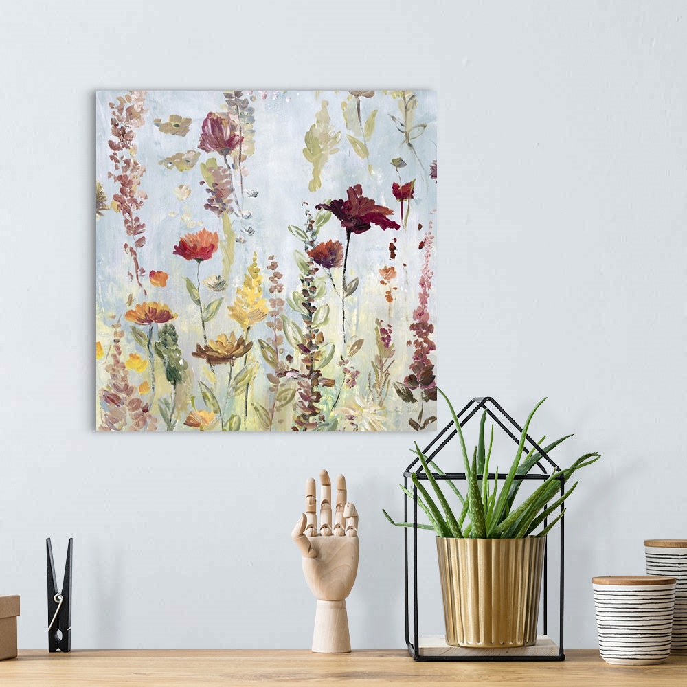 A bohemian room featuring Watercolor artwork of a garden full of tall, blooming flowers in shades of pink and yellow.