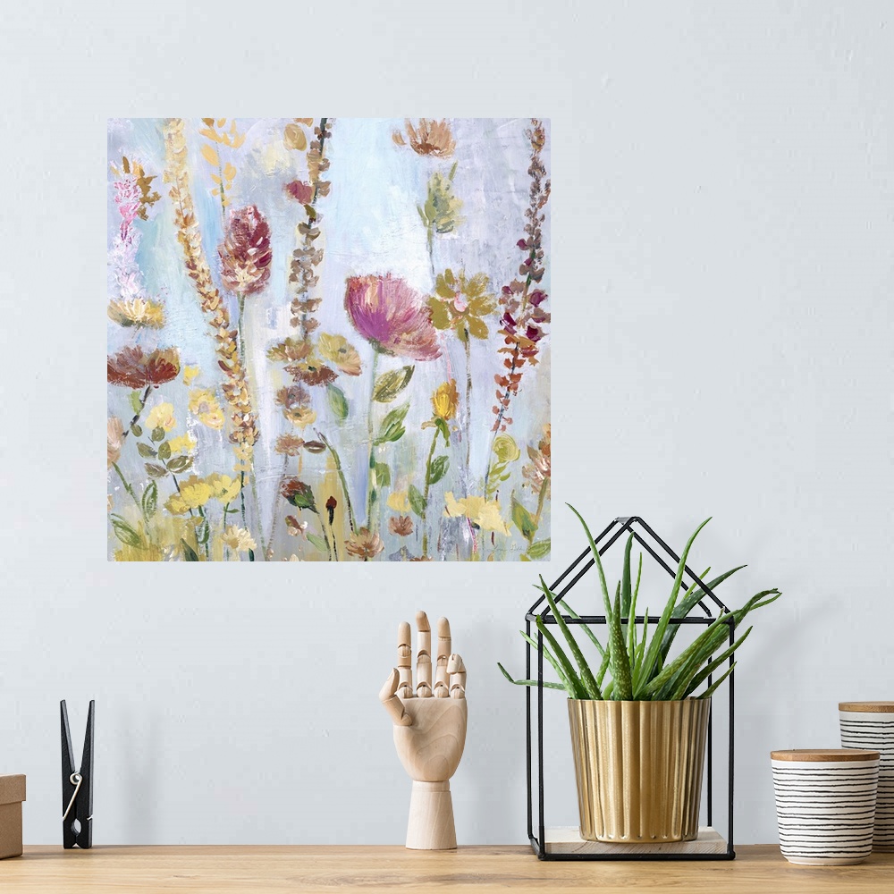A bohemian room featuring Watercolor artwork of a garden full of tall, blooming flowers in shades of pink and yellow.
