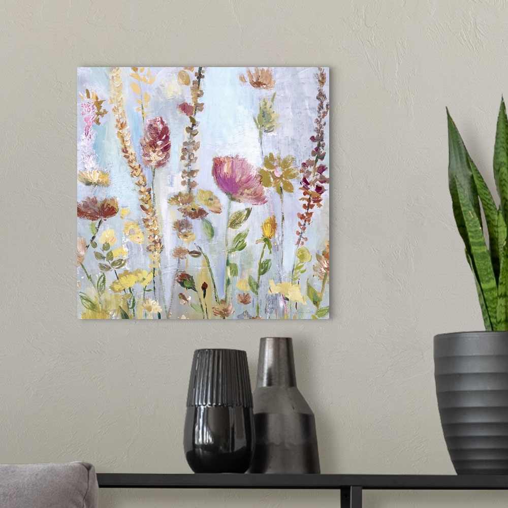 A modern room featuring Watercolor artwork of a garden full of tall, blooming flowers in shades of pink and yellow.