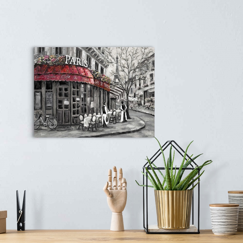 A bohemian room featuring Painting of a street scene in Paris, France, near an outdoor cafe.