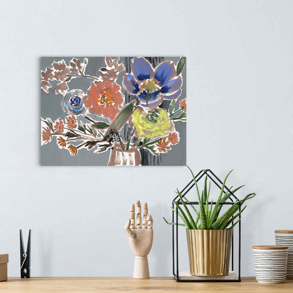 A bohemian room featuring Watercolor painting of a bouquet of orange, yellow, and blue flowers on grey.