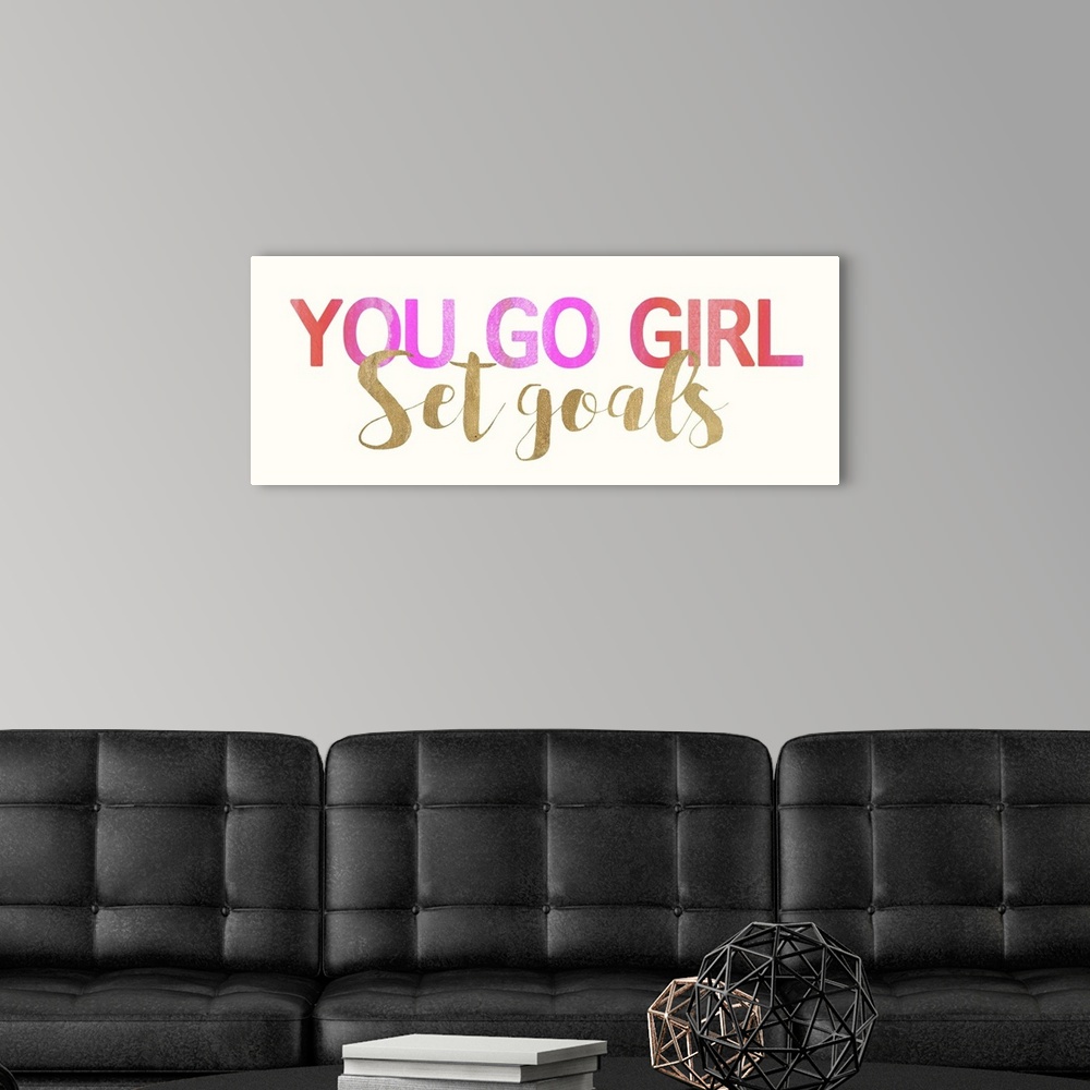 A modern room featuring Inspirational typography art in bold pink lettering and gold script.