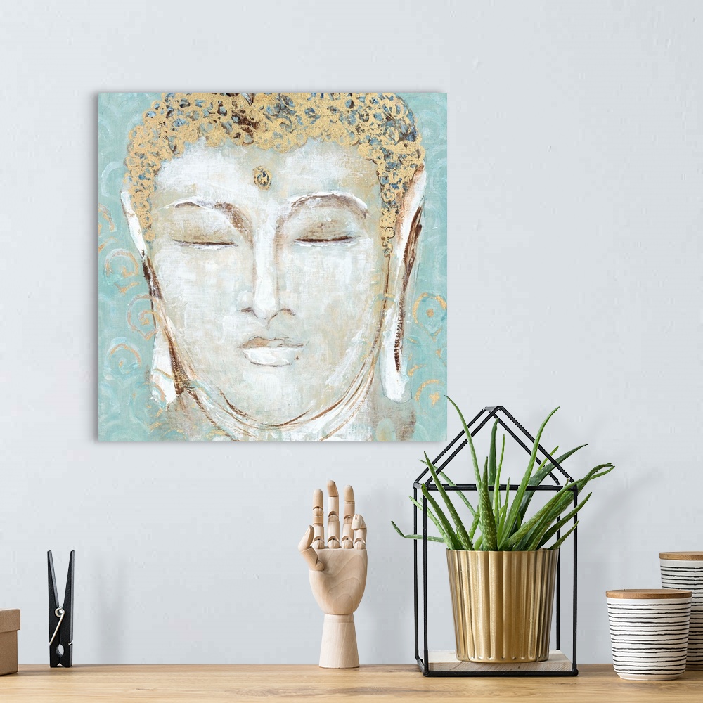 A bohemian room featuring Illustration of the face of Buddha with closed eyes, with golden details.