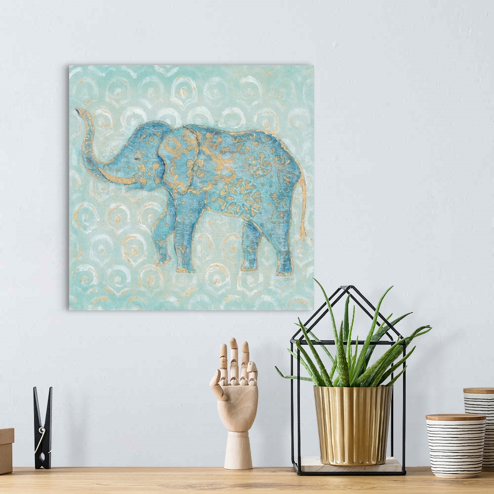 A bohemian room featuring Artwork of an Indian Elephant in blue with a golden design on a pale blue patterned background.