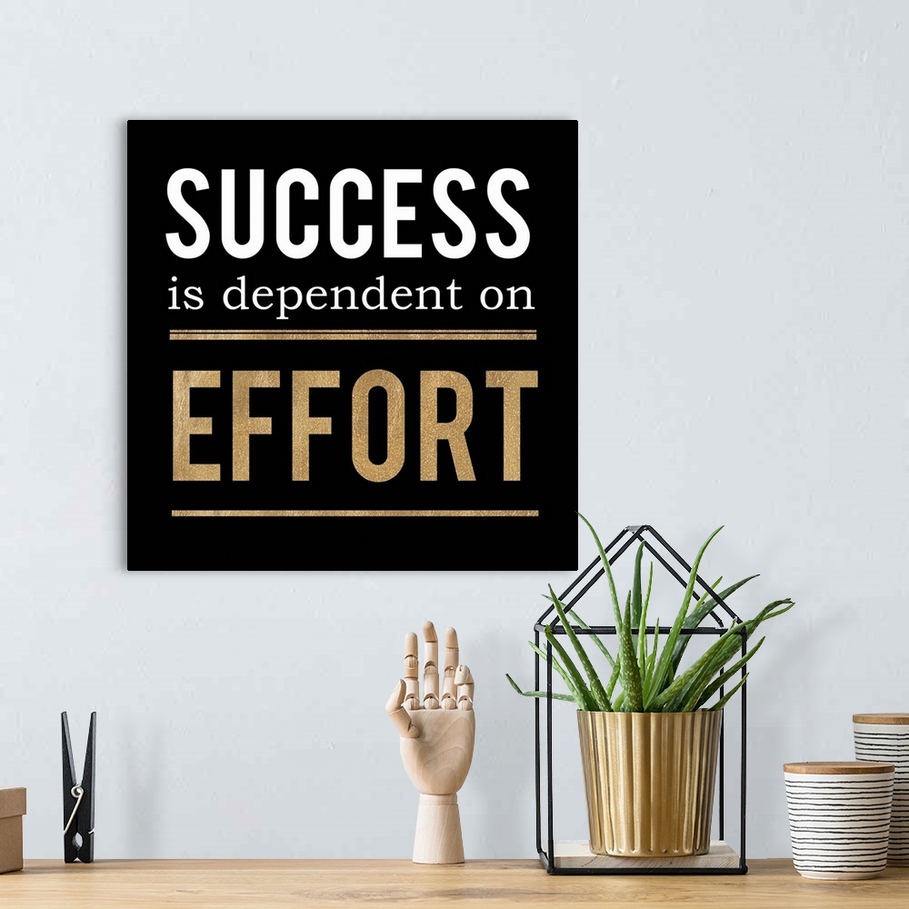 A bohemian room featuring Square office decor with "Success is dependent on Effort" written in white and gold on a black ba...
