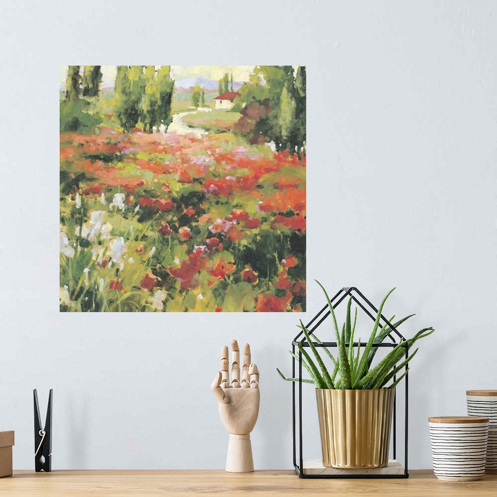 A bohemian room featuring Contemporary painting of a field of wildflowers in a valley, with a red roofed house in the dista...