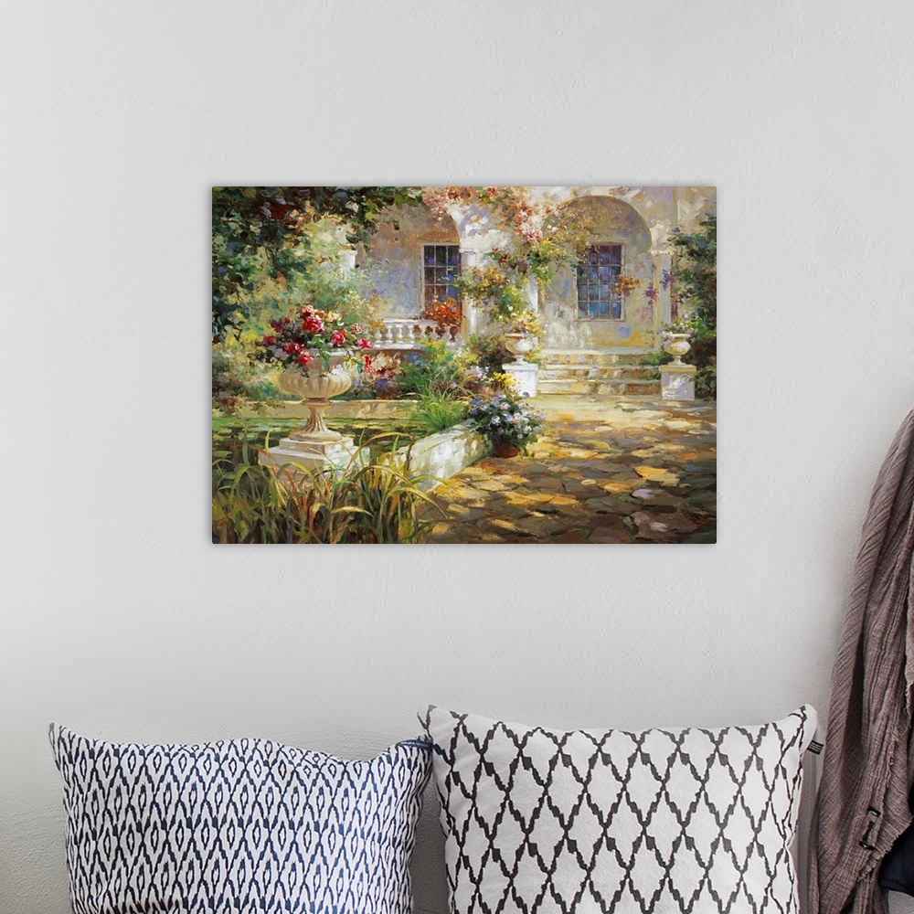 A bohemian room featuring Painting of a courtyard with arches and an urn full of flowers.