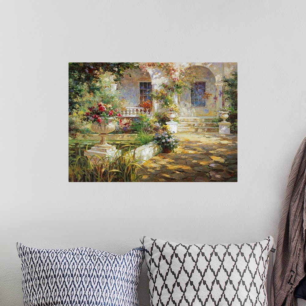 A bohemian room featuring Painting of a courtyard with arches and an urn full of flowers.