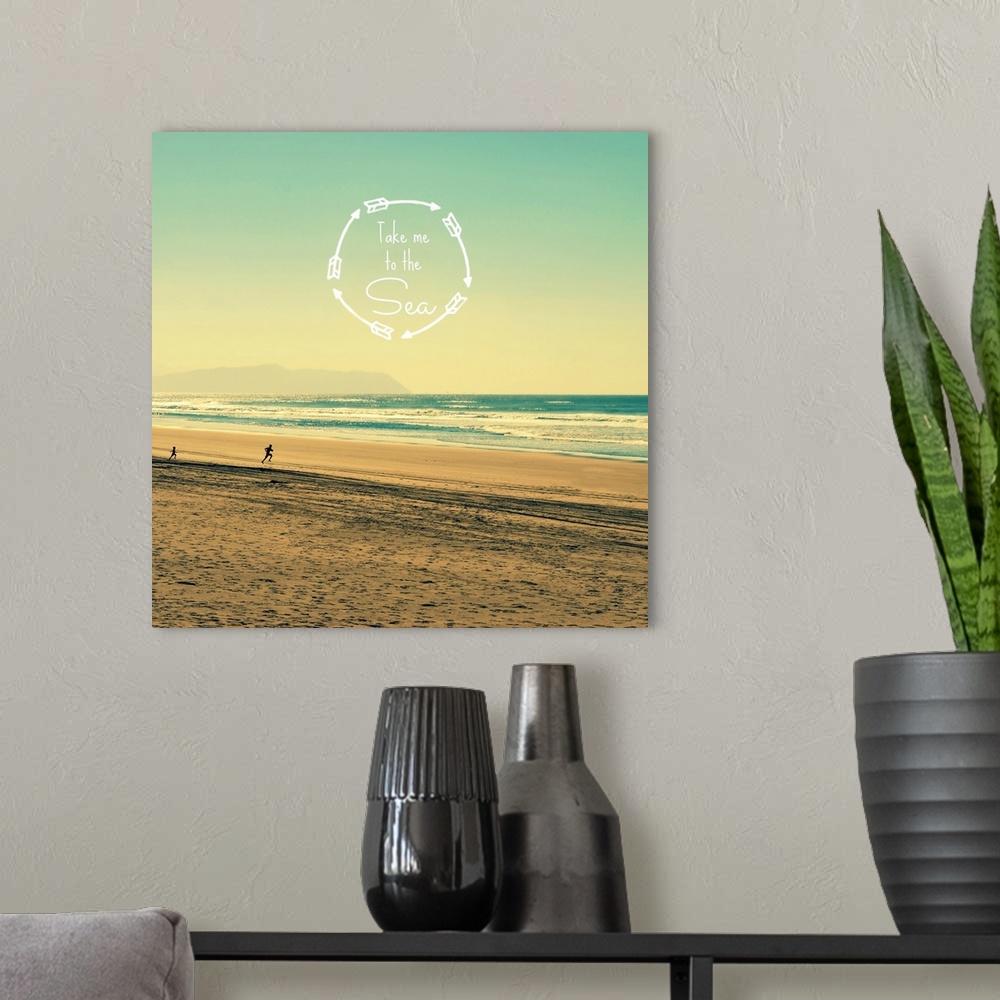 A modern room featuring "Take Me To The Sea" written inside a circle made with arrows on top of a square photograph of a ...