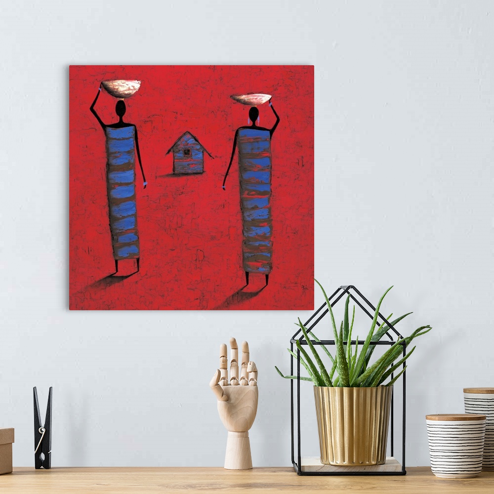 A bohemian room featuring Contemporary painting of two tribal figures carrying food, against a red background.