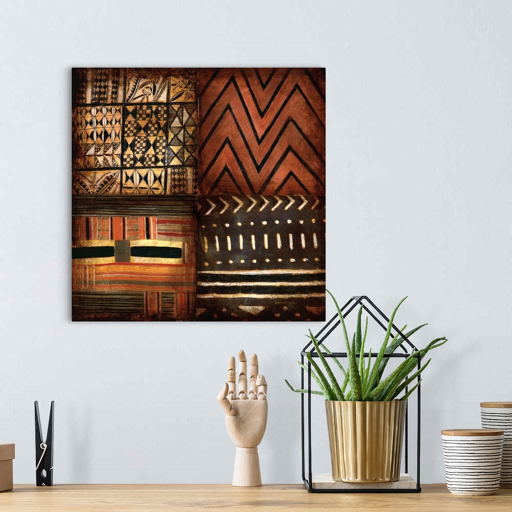 A bohemian room featuring Contemporary earth toned tribal patterned artwork.