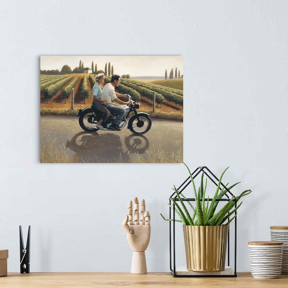 A bohemian room featuring Contemporary painting of a man and woman on a motorcycle riding through Tuscany.
