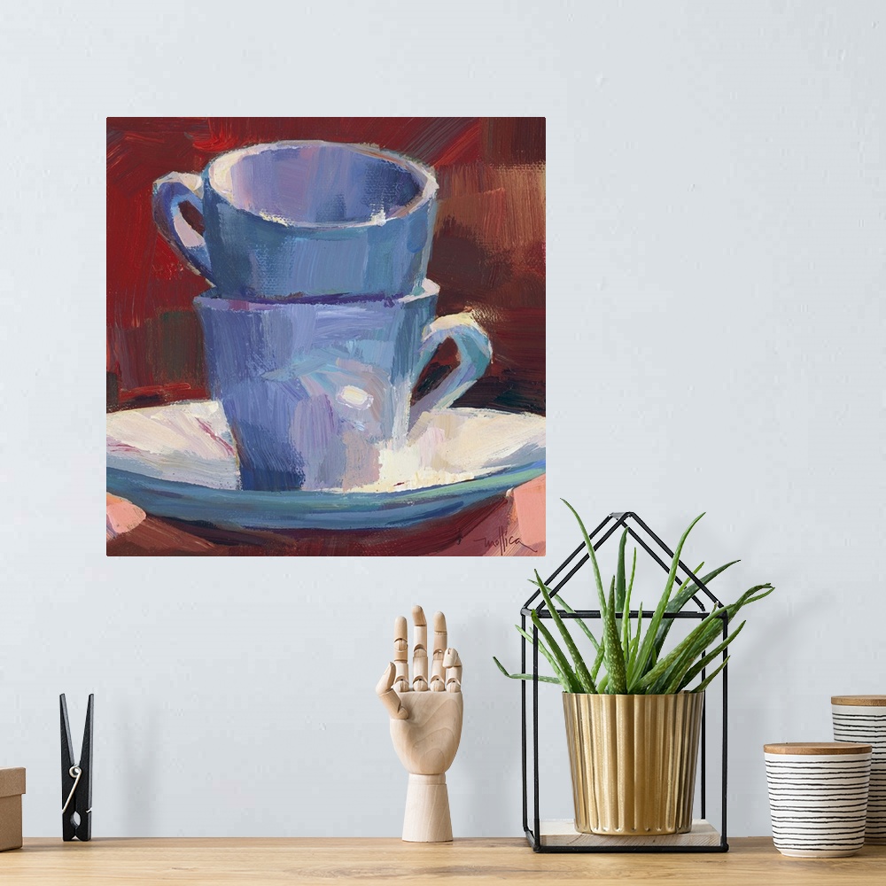 A bohemian room featuring Contemporary painting of teacups stacked on a teacup saucer against a red background.