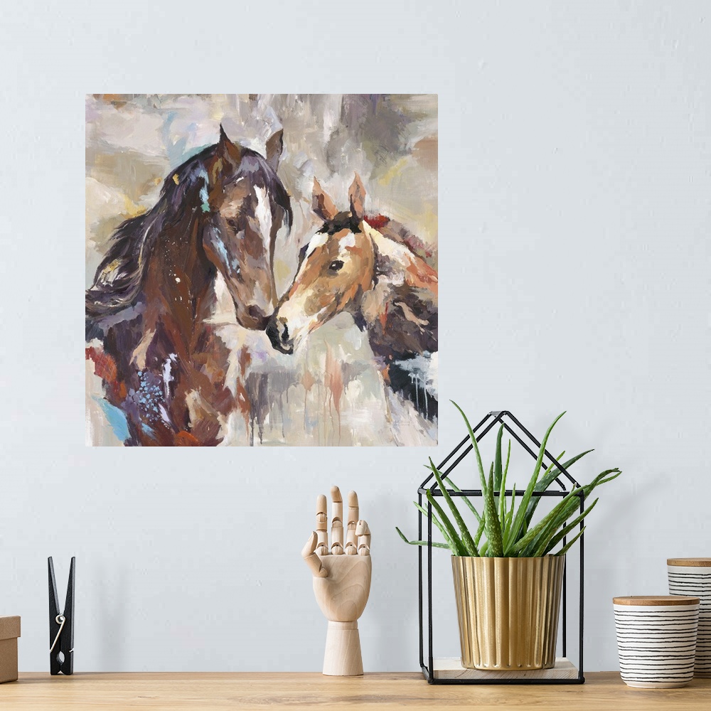 A bohemian room featuring Home decor artwork of two horses nuzzling.