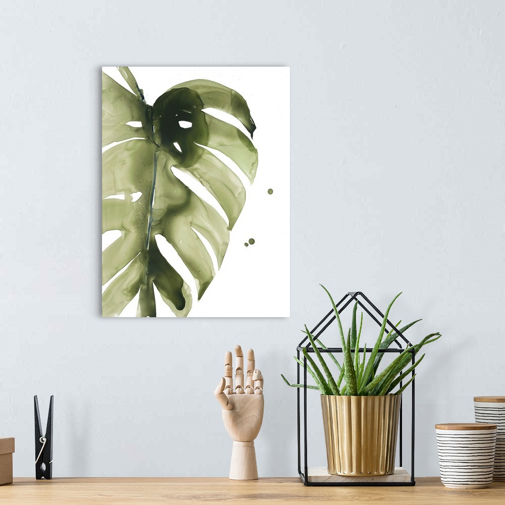 A bohemian room featuring Watercolor painting of a muted green tropical leaf on white.