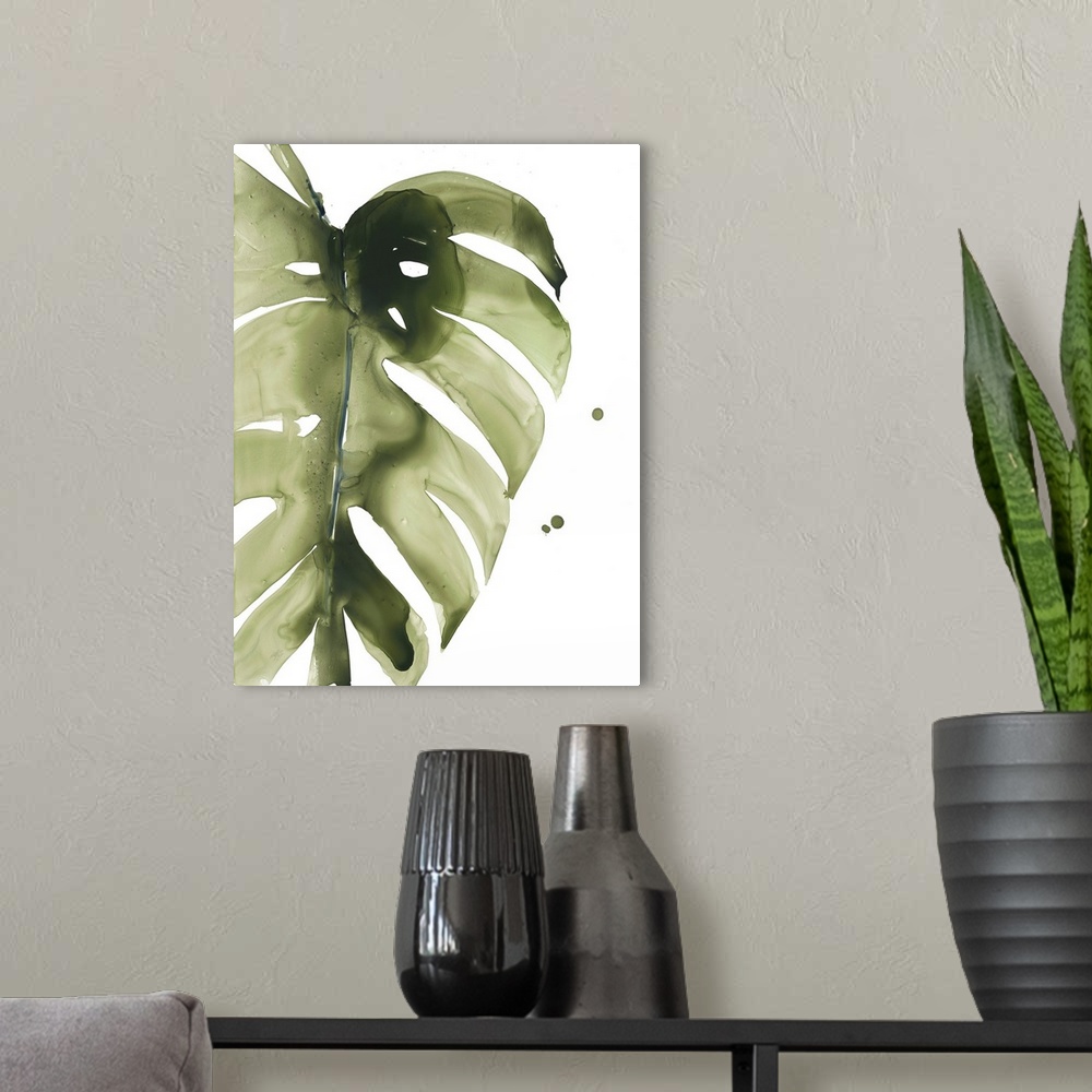 A modern room featuring Watercolor painting of a muted green tropical leaf on white.
